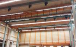 16 Bühnen-Elektrokettenzüge im Verbundbetrieb mit Stahlbau